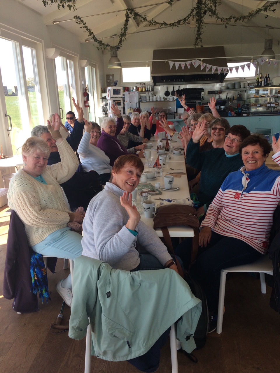 The women of Brixham WI enjoying a meal together
